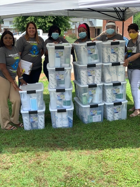 RCHA staff pictured with CARE kits