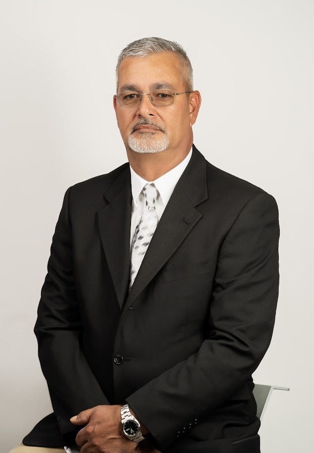 Luther Harrison, Maintenance Director sitting for a portrait.