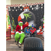 Two young children wearing winter coats and hats sitting next to the Grinch.