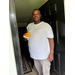  A man holding a doughnut. 